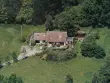 L'ancienne maison : un pavillon de parpaings de béton