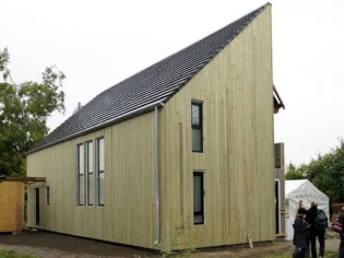 Une maison bois super-isolée avec de la laine de roche